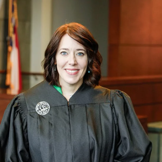 Kendra Montgomery-Blinn headshot in judge robes looking directly at the camera.